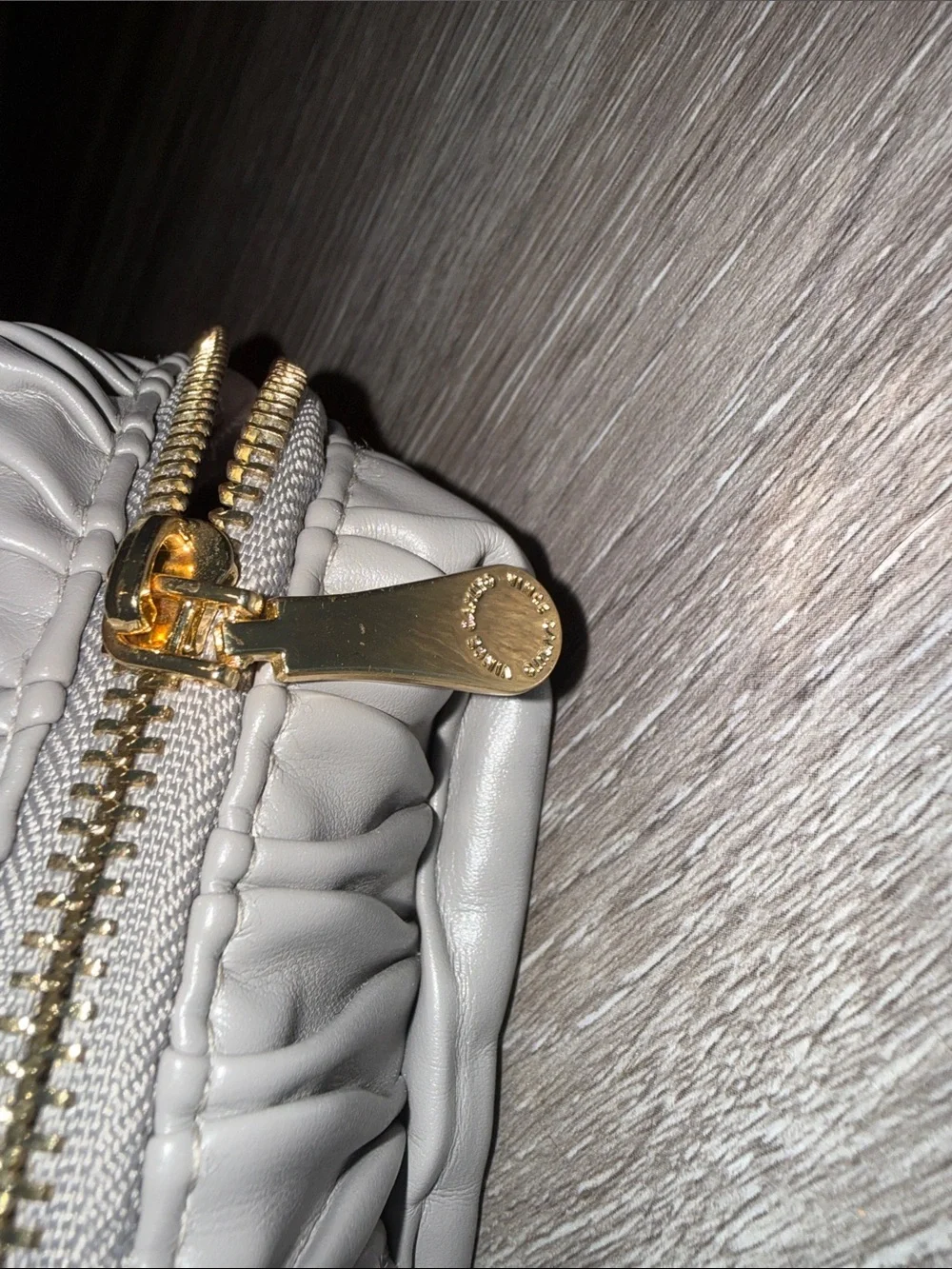 Vince Camuto Silver-Gray Quilted Ripple Cosmetic Bag zipper call out